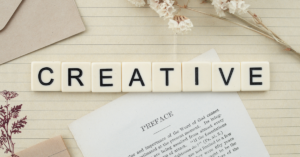 the word creative spelled out with letter tiles