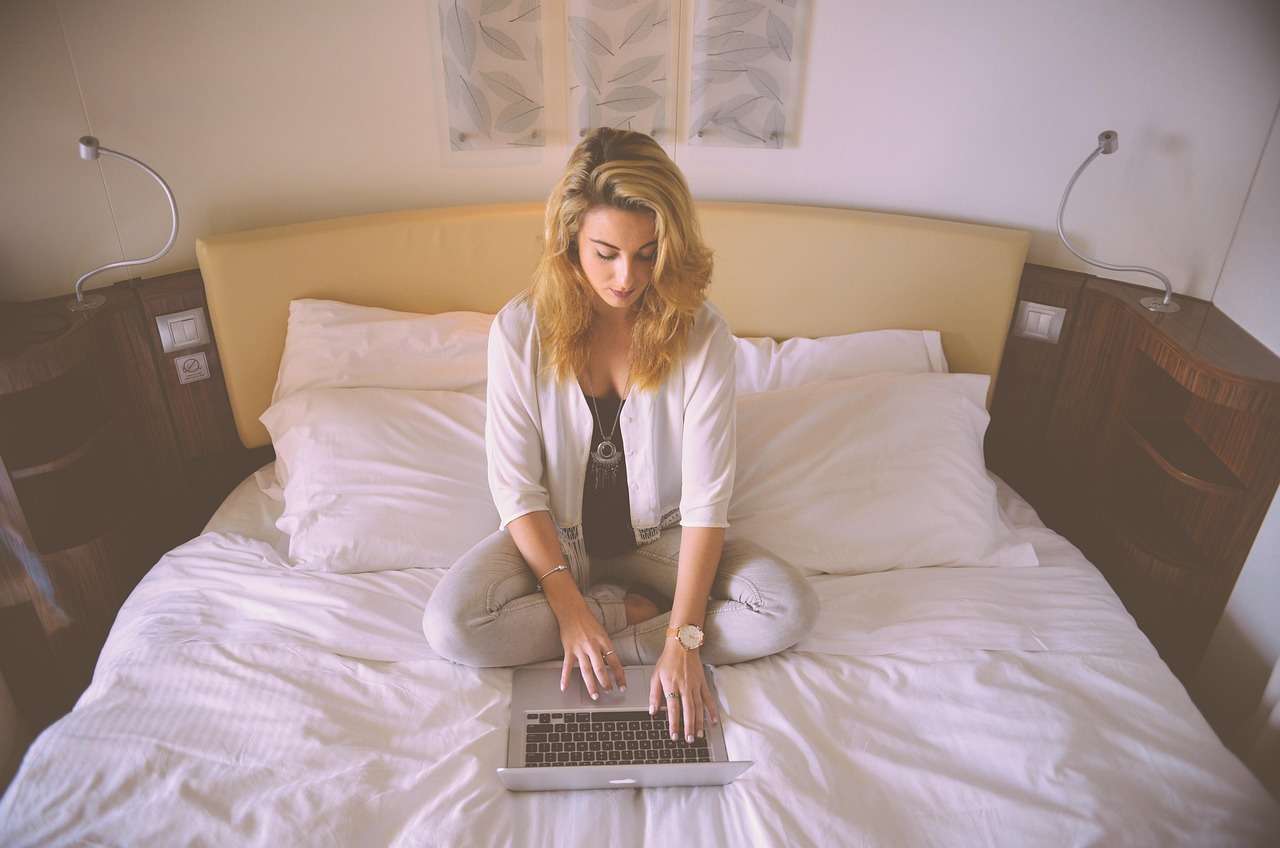 professional_woman_computer_night professional woman working in evening from bed